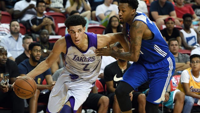 Lonzo Ball #2 of the Los Angeles Lakers drives to the basket against Isaiah Miles #41 of the Philadelphia 76ers during the 2017 Summer League at the Thomas & Mack Center on July 12, 2017 in Las Vegas, Nevada. Los Angeles won 103-102.