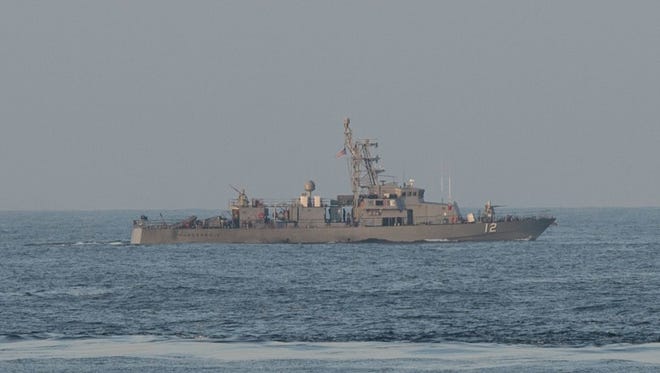 A handout photo made available by the Defense Department shows the coastal patrol craft USS Thunderbolt.