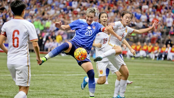 Wambach vies for possession against China defender Wu Haiyan during the first half.