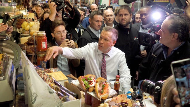 Kasich stops for lunch at Mike's Deli with chef David Greco in the Bronx on April 7, 2016.