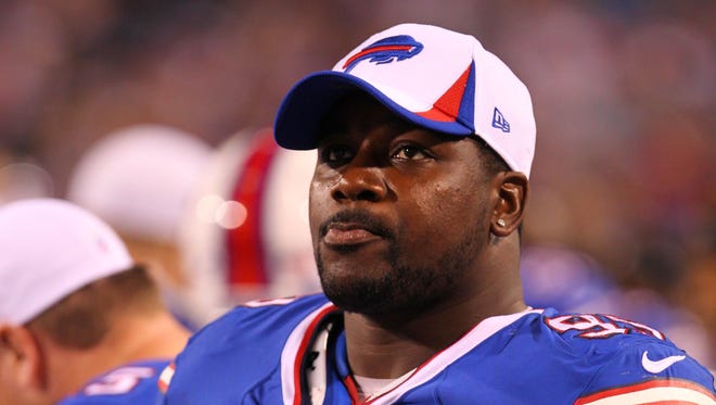 Buffalo Bills defensive tackle Marcell Dareus (99) watches the play from the sidelines during the second half against the Minnesota Vikings at Ralph Wilson Stadium.