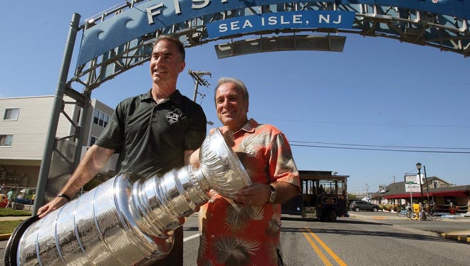 John Stevens holds up the Stanley Cup with Sea Isle City Mayor Leonard Desiderio after the Kings won it in 2014
