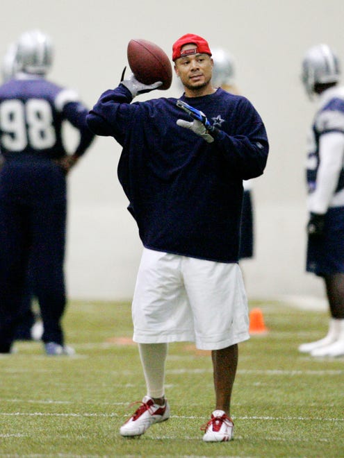 Dallas Cowboys wide receiver Terry Glenn tosses the ball after making a reception during practice at the Cowboys training facility in Irving, Texas, Tuesday, Dec. 12, 2007. Glenn went through some drills at practice for the first time all season Wednesday, a good indication the already dominant Dallas offense could have another weapon by the playoffs. (AP Photo/Tony Gutierrez) ORG XMIT: DN102