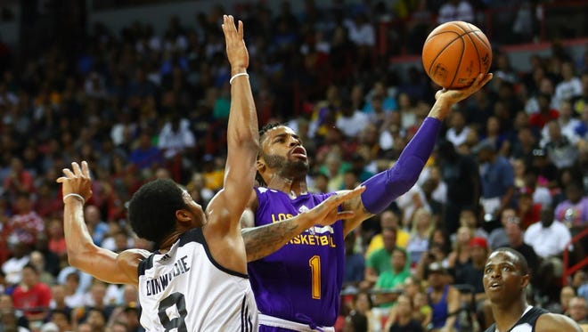 Los Angeles Lakers guard Vander Blue (1) drives to the basket against Brooklyn Nets guard Spencer Dinwiddie (8).