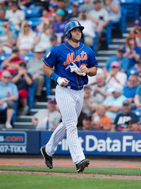 New York Mets designated hitter Tim Tebow makes his way back to the dugout in the fourth inning after he grounded into a double play during his second at bat against the Boston Red Sox on Wednesday, March 8, 2017, at First Data Field in Port St. Lucie. Lucas Duda scored on the hit. The Mets won 8-7.