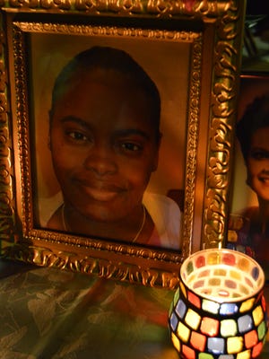 Chiquina Robinson's photo displayed at a memorial ceremony for murder victims.