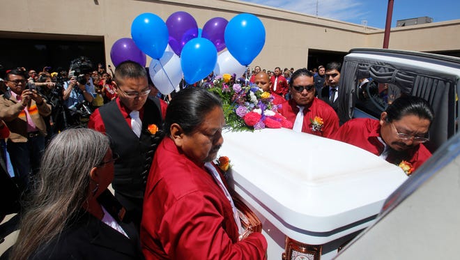 Pallbearers carry the casket containing Ashlynne Mike on May 6, 2016, after her funeral service.