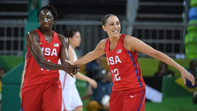 United States center Tina Charles (14) and United States guard Diana Taurasi (12) celebrate against China during the women's preliminary round in the Rio 2016 Summer Olympic Games at Youth Arena.