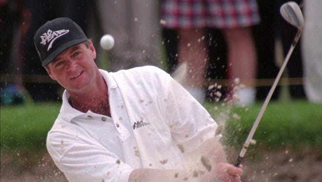South Africa's Wayne Wester chips out of a bunker during the World Cup of Golf in 1996.
