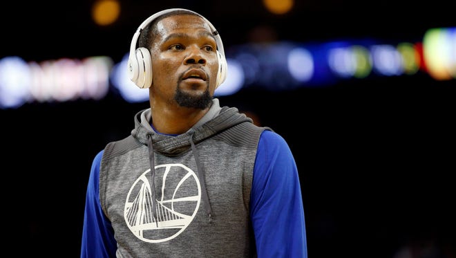 Golden State Warriors forward Kevin Durant (35) stands on the court before the start of a game against the New Orleans Pelicans at Oracle Arena.