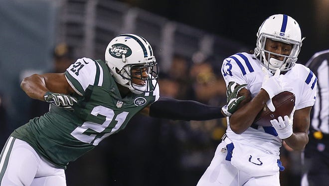 Indianapolis Colts wide receiver T.Y. Hilton (13) makes a reception while being defended by New York Jets free safety Marcus Gilchrist (21) during the 1st half at MetLife Stadium in East Rutherford, N.J., on Monday, Dec. 5, 2016.