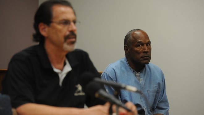 O.J. Simpson listens during the testimony of Bruce Forming during his parole hearing at Lovelock Correctional Center.