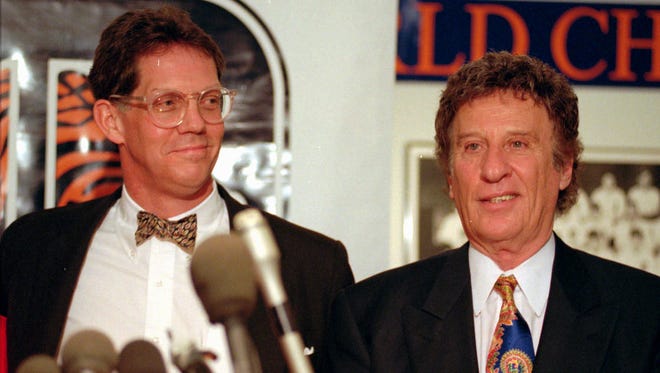 Mike Ilitch and John McHale Jr. pose for pictures  after McHale was introduced as team president at a news conference in 1995.