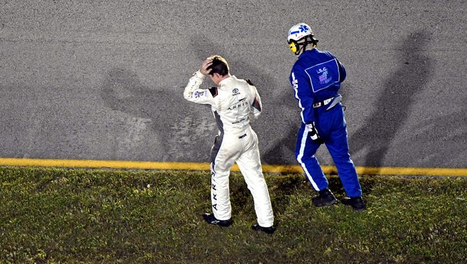 Chase finale: Carl Edwards, left, heads to the infield care center after crashing out of the race.