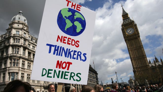 A protestor holds a placard during the March for Science in London.