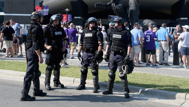 Charlotte Mecklenburg Police Department officers deploy outside of Bank of America Stadium prior to the game between the Minnesota Vikings and Carolina Panthers at Bank of America Stadium on Sept. 25, 2016 in Charlotte, N.C.  Charlotte has been the site of civil unrest since Keith Lamont Scott, 43, was shot and killed by police officers at an apartment complex near UNC Charlotte.