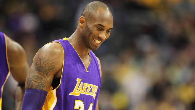 Los Angeles Lakers forward Kobe Bryant (24) reacts during the first half against the Denver Nuggets at Pepsi Center.