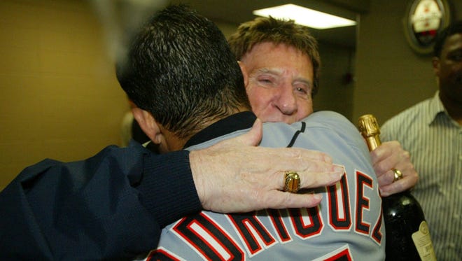 Tigers owner Mike Ilitch and Tigers catcher Ivan Rodriguez celebrate their clinching of a playoff spot after a win over the Royals in Kansas City on Sept. 24, 2006. The Tigers went on to win the A.L. pennant, but lost to the St. Louis Cardinals, 4-1, in the World Series.