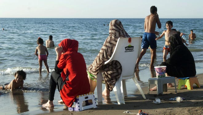 Algerian families gather on a public beach, reserved especially for families and their children, in the capital Algiers on Aug. 3.
