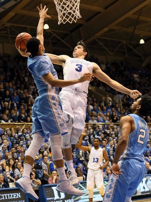 Duke Blue Devils guard Grayson Allen (3) drives to the basket against North Carolina Tar Heels guard Marcus Paige (5) in the second half of their game at Cameron Indoor Stadium.