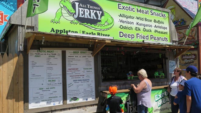 Customers wait in line for snacks ranging from ghost pepper popcorn to cricket nachos. Jess Jerky, the owner of All Things Jerky, said the nachos would likely make a return next year due to their popularity.