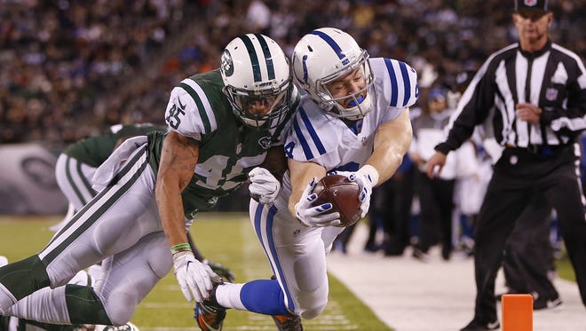 New York Jets strong safety Rontez Miles (45) hits Indianapolis Colts tight end Jack Doyle (84) as he dives for the goal line during the second quarter at MetLife Stadium in East Rutherford, N.J., on Monday, Dec. 5, 2016. Doyle fumbled the ball out of the end zone on the play turing it over to the Jets on a touchback.
