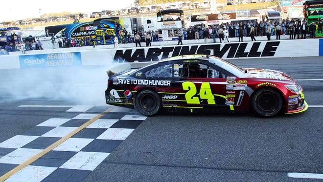 Jeff Gordon burns out after winning the Goody's Fast Relief 500 on Oct. 27, 2013, for his eighth career win at Martinsville Speedway, his most at any track.