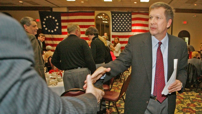 Kasich greets guests at the Clermont County, Ohio, GOP Lincoln Day dinner on Feb. 17, 2007.