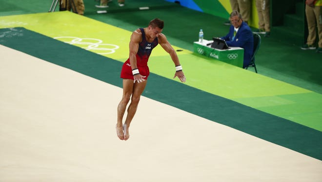 Samuel Mikulak of the United States competes  during the men's floor exercise final in the Rio 2016 Summer Olympic Games at Rio Olympic Arena.