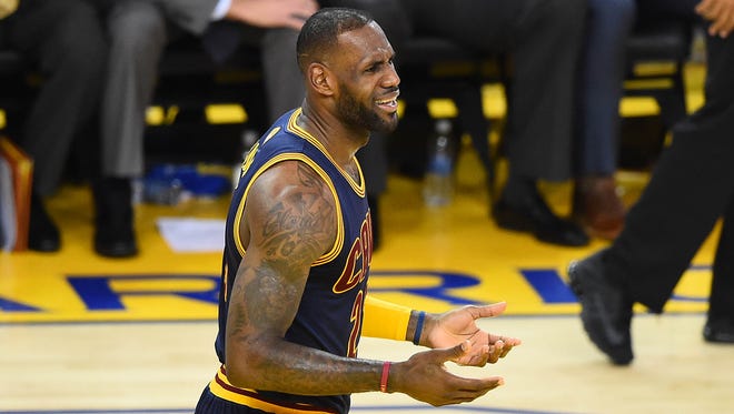 Cleveland Cavaliers forward LeBron James (23) reacts to a foul called against him in action against the Golden State Warriors during the second half in game one of the NBA Finals at Oracle Arena.