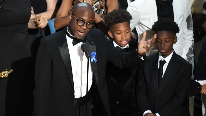 Writer/director Barry Jenkins, actors Jaden Piner and Alex R. Hibbert accept Best Picture for 'Moonlight' onstage during the 89th Annual Academy Award.