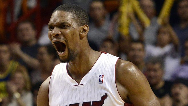 Mar 12, 2014; Miami, FL, USA; Miami Heat center Chris Bosh (1) reacts during the second half against the Brooklyn Nets at American Airlines Arena.