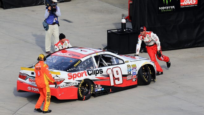 Round 3: Carl Edwards pulls his car into the garage after hitting the wall at Martinsville. Edwards finished 23 laps down in 36th-place and likely finds himself in a must-win situation in the next two races Chase races.