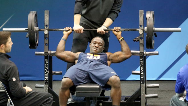 Kentucky running back Stanley Williams performs in the bench press at the 2017 NFL football scouting combine Thursday, March 2, 2017, in Indianapolis.