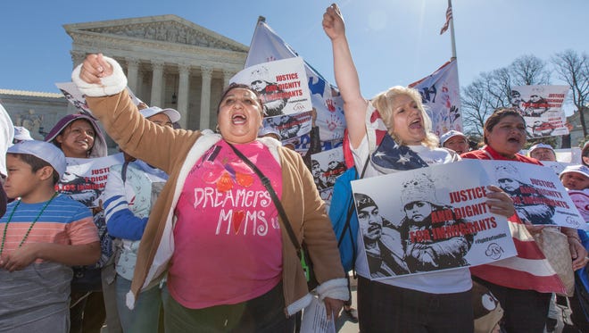 Immigration activists demonstrate at the Supreme Court earlier this year in support of President Obama's executive order to grant relief from deportation in order to keep immigrant families together. The court heard a new immigration case Wednesday.