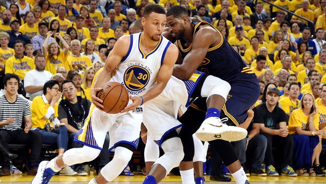 Golden State Warriors guard Stephen Curry (30) grabs a loose ball during the first quarter against the Cleveland Cavaliers in Game 2.