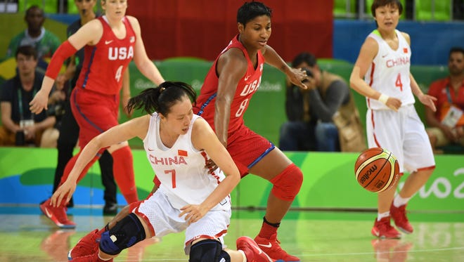 Angel Mccoughtry of the United States, left, fights for a loose ball with Ting Shao of China during the women's preliminary round in the Rio 2016 Summer Olympic Games at Youth Arena.