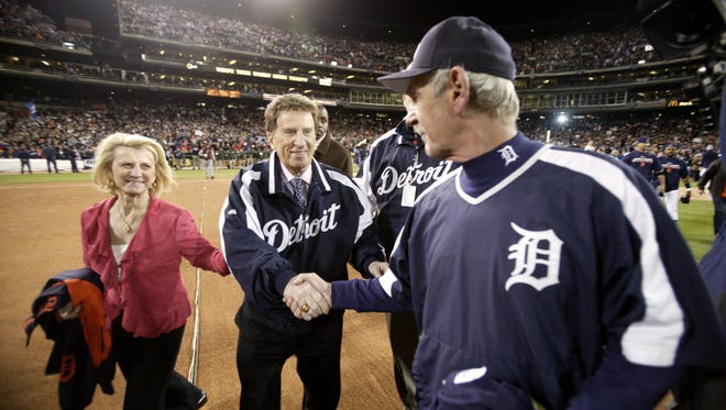 Tigers manager Jim Leyland, right, with Marian and Mike Ilitch after the Tigers defeated the Oakland Athletics 6-3 in Game 4 of the 2006 ALCS at Comerica Park to advance to the World Series on Saturday, Oct. 14, 2006.