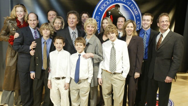 In 2003, Mike Ilitch took photos with his wife Marian and the family after he was inducted into the Hockey Hall of Fame in Toronto.
