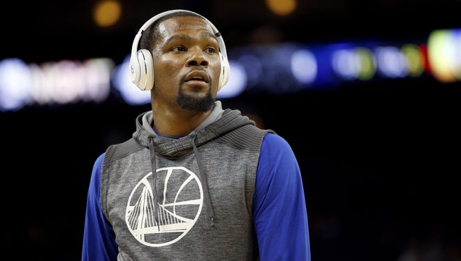 Golden State Warriors forward Kevin Durant (35) stands on the court before the start of a game against the New Orleans Pelicans at Oracle Arena.