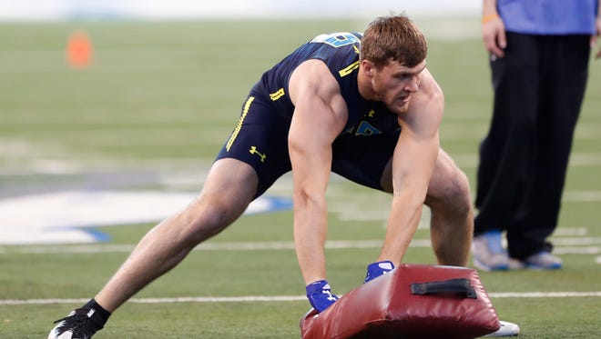 Wisconsin linebacker T.J. Watt runs through drills in the hopes of joining brother J.J. to the NFL.