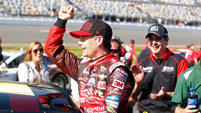 Jeff Gordon celebrates winning the pole for the 2015 Daytona 500.