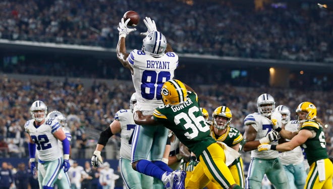 Cowboys wide receiver Dez Bryant (88) catches a touchdown during the fourth quarter against the Packers.