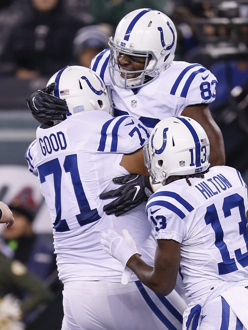 Indianapolis Colts tight end Dwayne Allen (83), right, celebrates with offensive guard Denzelle Good (71) and T.Y. Hilton (13) after scoring against the New York Jets on a 7 yard screen pass from quarterback Andrew Luck during the Colts first drive of the game at MetLife Stadium in East Rutherford, N.J., on Monday, Dec. 5, 2016.