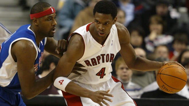 Chris Bosh of the Toronto Raptors is guarded by Los Angeles Clippers forward Elton Brand during a game in Toronto, Canada in 2007.