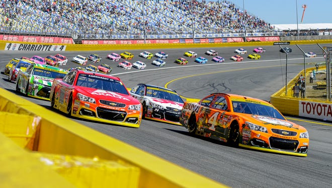 Round 2: Kevin Harvick (4) and Alex Bowman (88) lead the field to green at Charlotte Motor Speedway on Oct. 9.