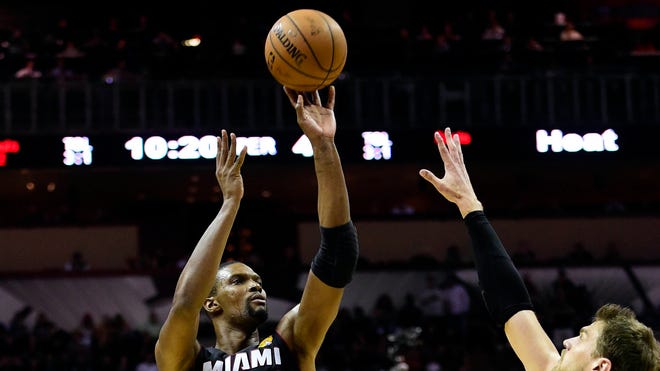 Jun 8, 2014; San Antonio, TX, USA; Miami Heat center Chris Bosh (1) shoots the ball over San Antonio Spurs center Tiago Splitter (22) in game two of the 2014 NBA Finals at AT&T Center.