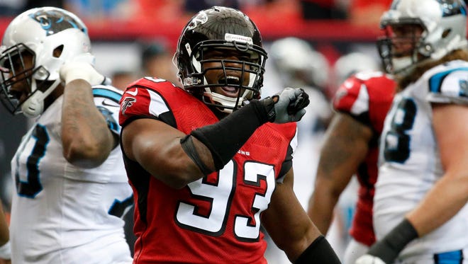 Atlanta Falcons defensive end Dwight Freeney (93) celebrates a sack of Carolina Panthers quarterback Cam Newton (1) in the second quarter of their game at the Georgia Dome.