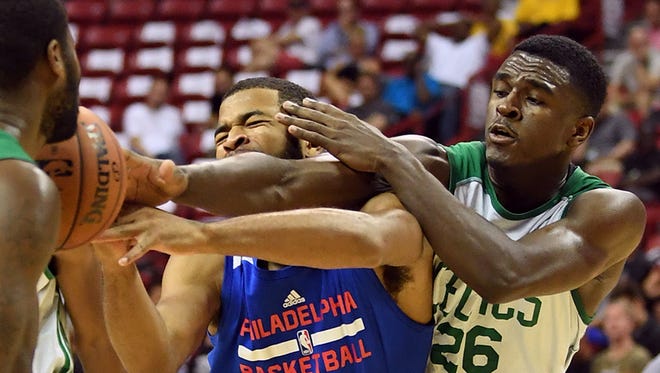 July 11: Celtics guard Jabari Bird, right, reaches in to foul 76ers guard Aaron Harrison, left, durng an NBA Summer League game at Thomas & Mack Center in Las Vegas.