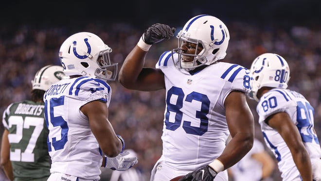 Indianapolis Colts tight end Dwayne Allen (83) celebrates with Phillip Dorsett (15) after catching a 21 yard pass against the New York Jets from quarterback Andrew Luck to score his second touchdown of the first quarter at MetLife Stadium in East Rutherford, N.J., on Monday, Dec. 5, 2016.